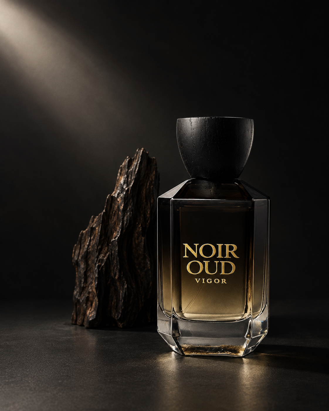 Noir Oud bottle beside oud wood on a dark background